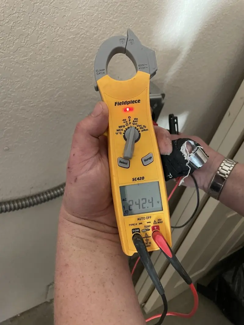 Voltage testing with clamp meter during Aluminum Wiring Replacement in Sienna
